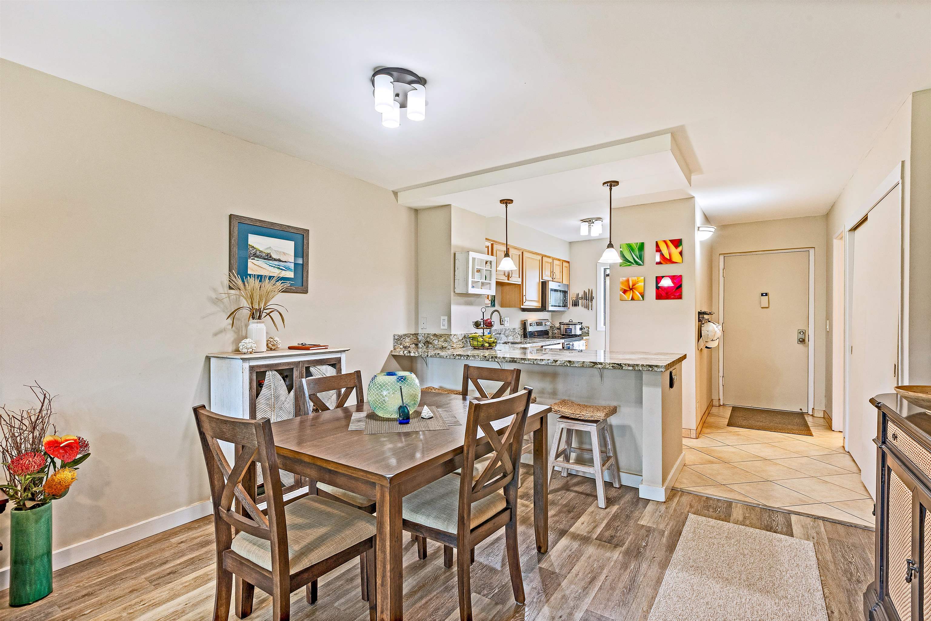 3788 Lower Honoapiilani Road, Unit A110 Lahaina, HI 96761 - Photo 9 of 35 a dining room with furniture and wooden floor