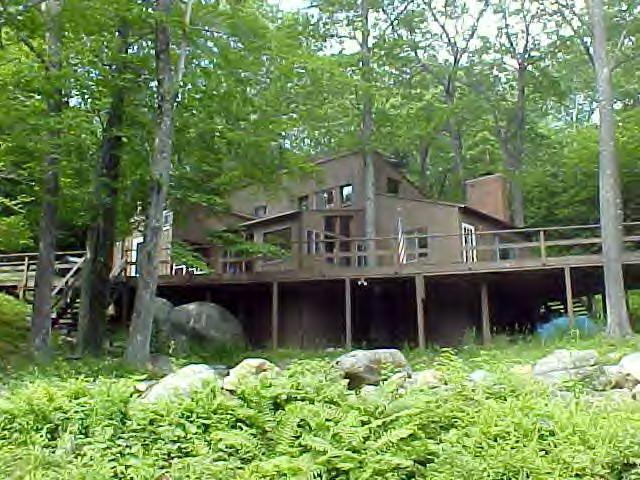 1060 George Carter Road Becket, MA 01223 - Photo 1 of 15 front view of a house with a small yard