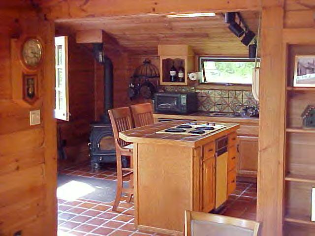 1060 George Carter Road Becket, MA 01223 - Photo 3 of 15 a view of a kitchen with chair and front door