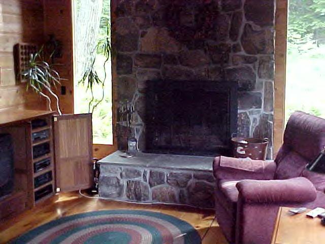 1060 George Carter Road Becket, MA 01223 - Photo 6 of 15 a living room with furniture and a fireplace