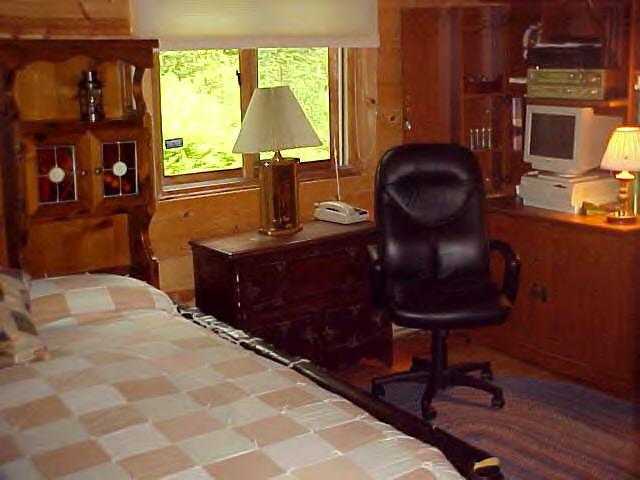 1060 George Carter Road Becket, MA 01223 - Photo 7 of 15 a bedroom with a bed and a window