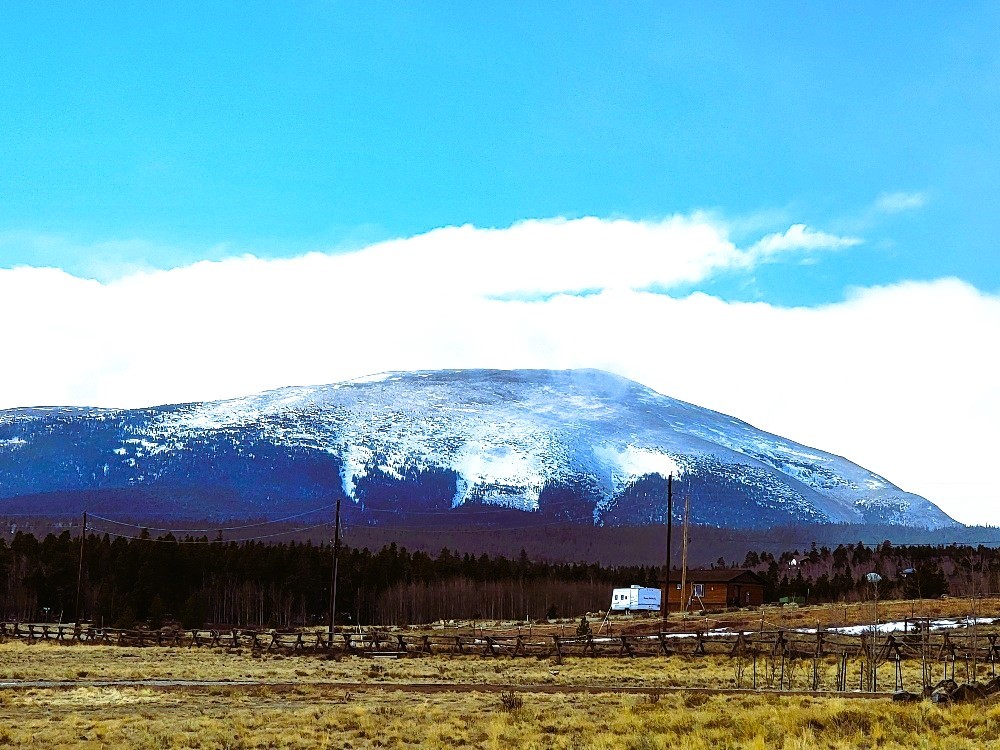 542 Thick Spike Road Fairplay, CO 80440 - Photo 3 of 33 a view of a lake with a mountain in the background