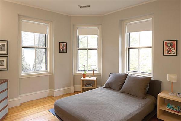 203 Aspinwall Avenue Brookline, MA 02446 - Photo 8 of 9 a bedroom with a bed and wooden floor