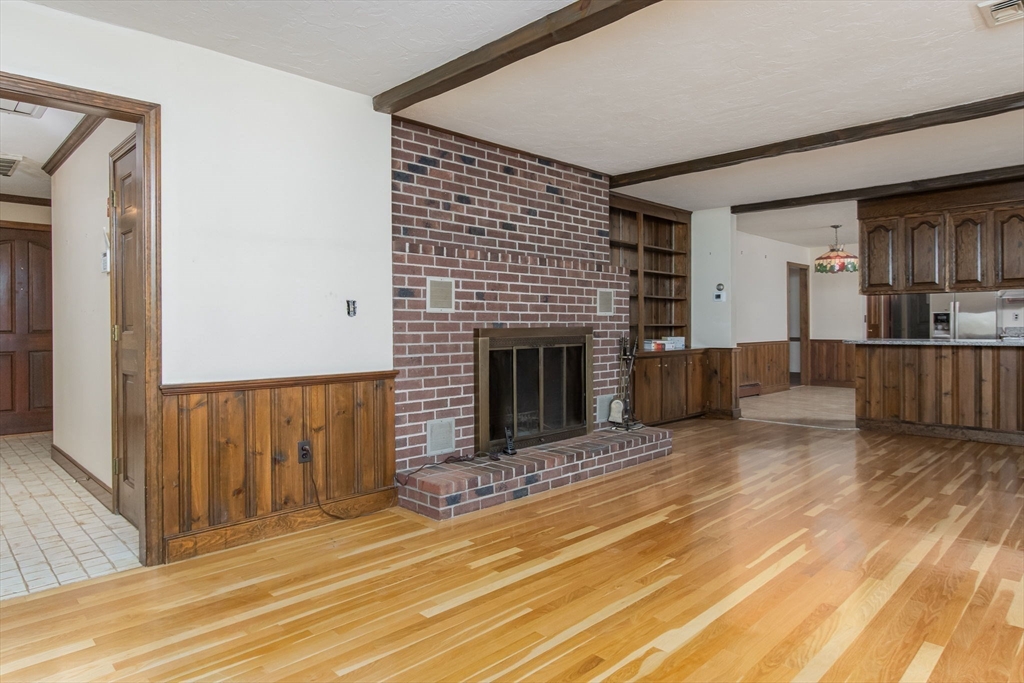 21 Saddle Lane Groton, MA 01450 - Photo 13 of 31 a view of a livingroom with a fireplace