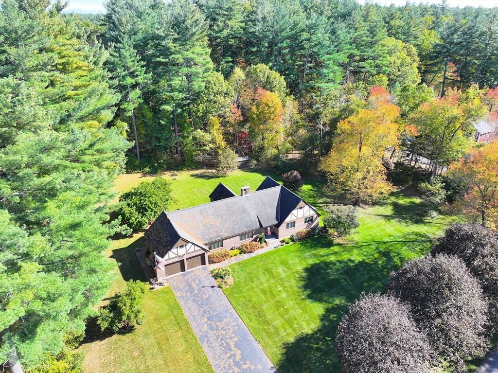 21 Saddle Lane Groton, MA 01450 - Photo 2 of 31 an aerial view of a house with swimming pool and garden