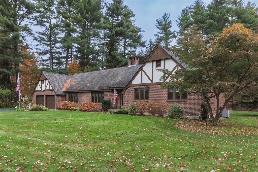 21 Saddle Lane Groton, MA 01450 - Photo 27 of 31 a front view of house with yard and green space