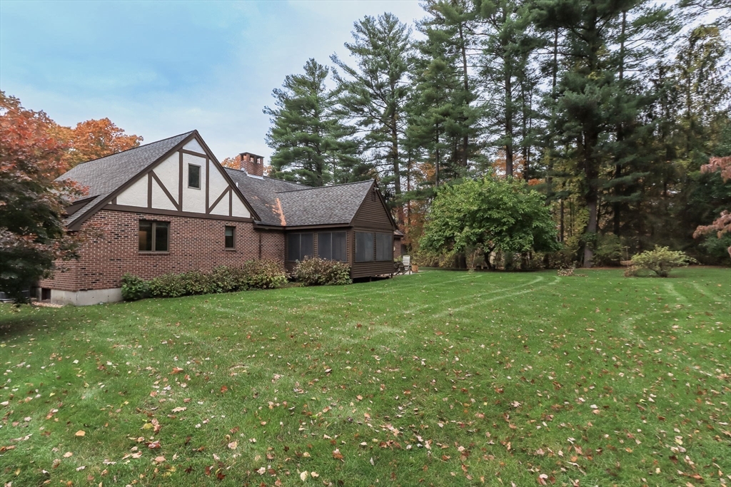 21 Saddle Lane Groton, MA 01450 - Photo 28 of 31 a front view of a house with yard and green space