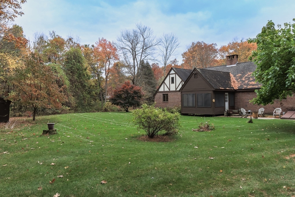 21 Saddle Lane Groton, MA 01450 - Photo 29 of 31 a front view of a house with garden