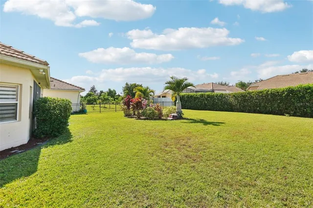 a house view with swimming pool and garden