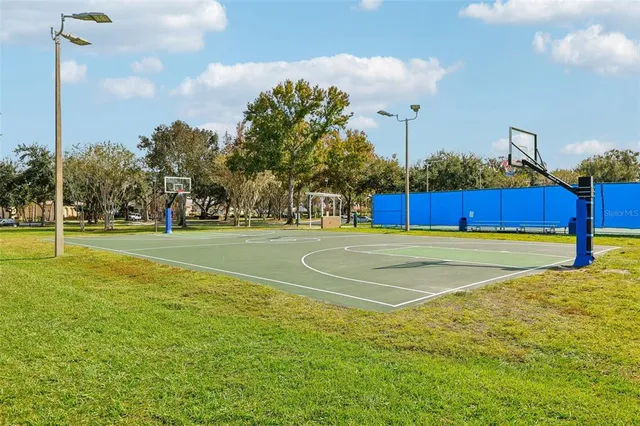 a swimming pool with outdoor seating and yard