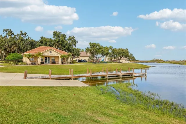 swimming pool with outdoor seating and garden