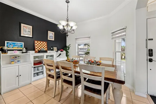 a view of a dining room with furniture and chandelier