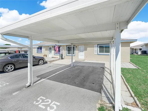 a view of a car park in front of house