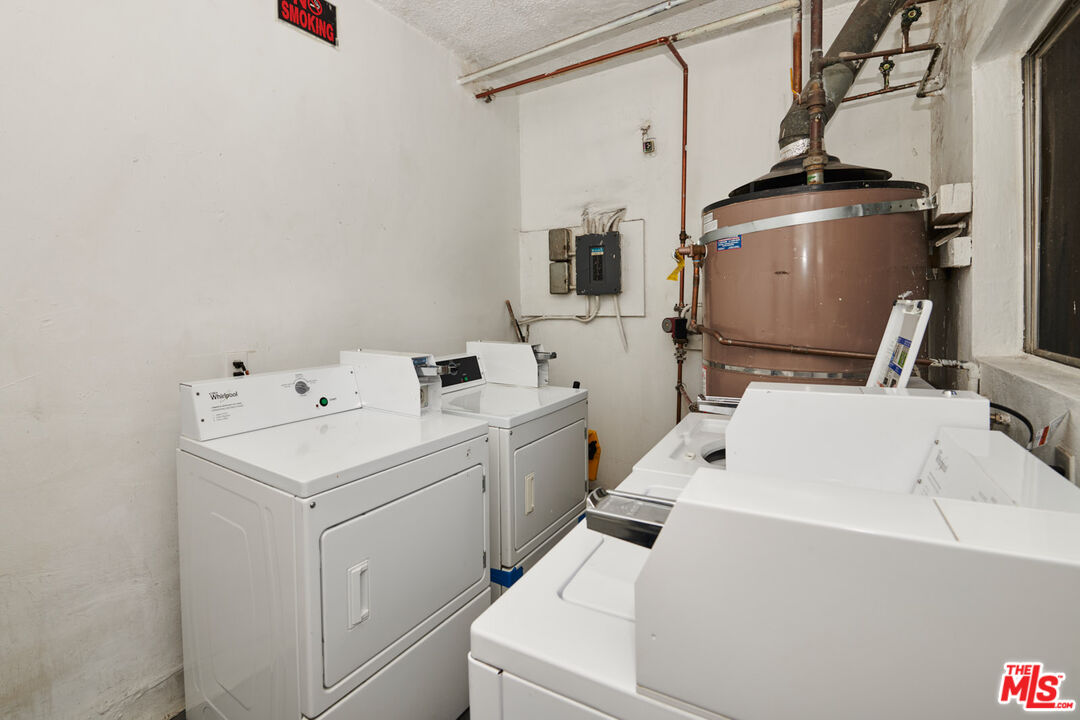 3355 South Canfield Avenue, Unit 11 Los Angeles, CA 90034 - Photo 18 of 23 a utility room with dryer and washer