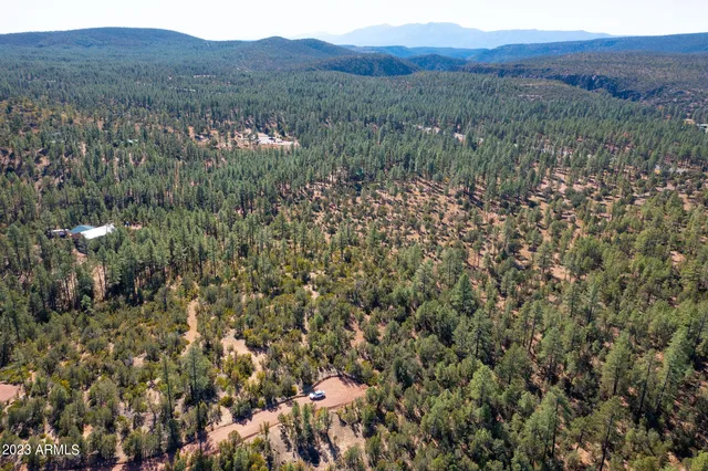 a view of a house with a snow in the yard