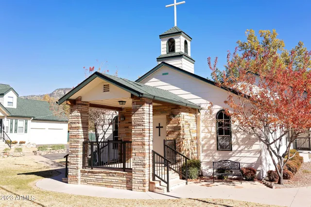 a front view of a house with parking space