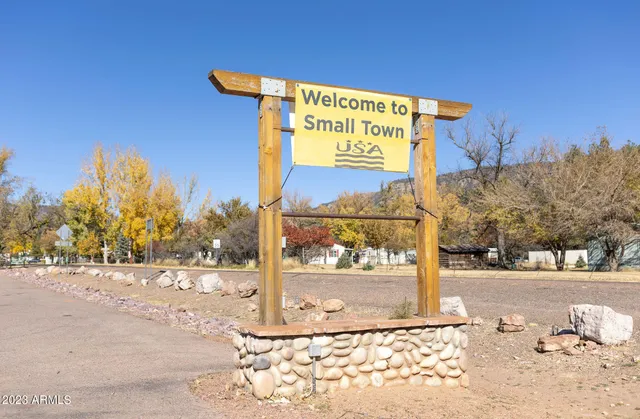 a view of swimming pool next to a yard
