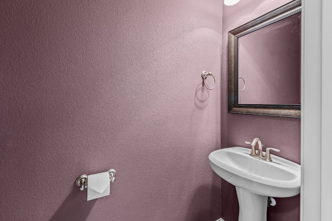 2813 Granite Hill Cove Leander, TX 78641 - Photo 18 of 35 a bathroom with a sink mirror and toilet