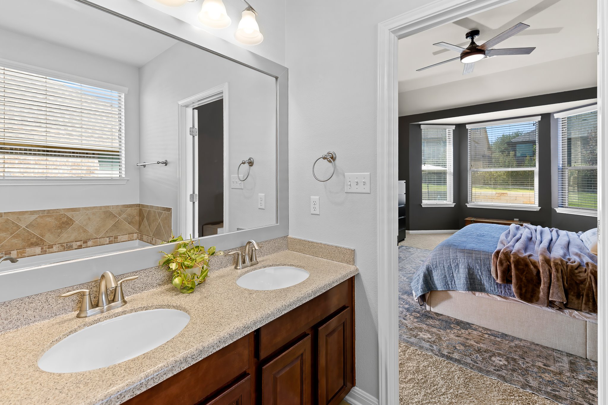 2813 Granite Hill Cove Leander, TX 78641 - Photo 22 of 35 Full bath with a bath, double vanity, a separate shower and garden tub