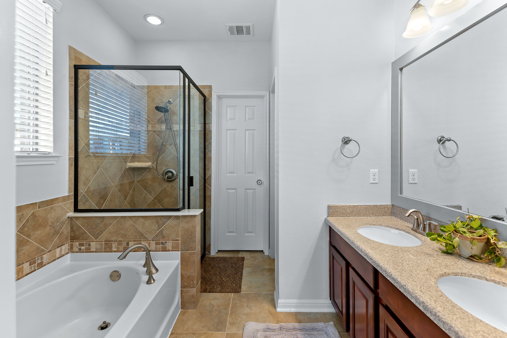 2813 Granite Hill Cove Leander, TX 78641 - Photo 23 of 39 Full bath with a bath, double vanity, a separate shower and garden tub