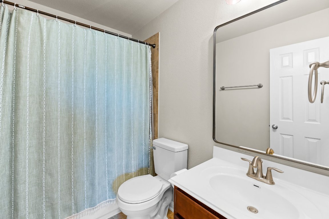 2813 Granite Hill Cove Leander, TX 78641 - Photo 26 of 35 a bathroom with a sink a toilet and shower