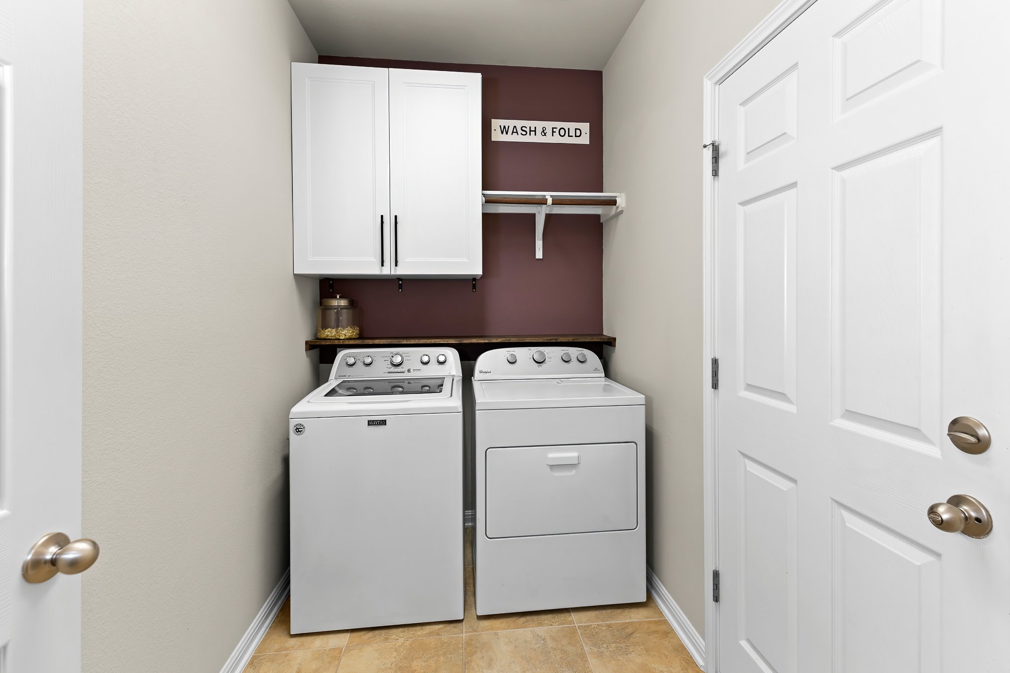 2813 Granite Hill Cove Leander, TX 78641 - Photo 32 of 39 Laundry area featuring cabinet space and washer and dryer