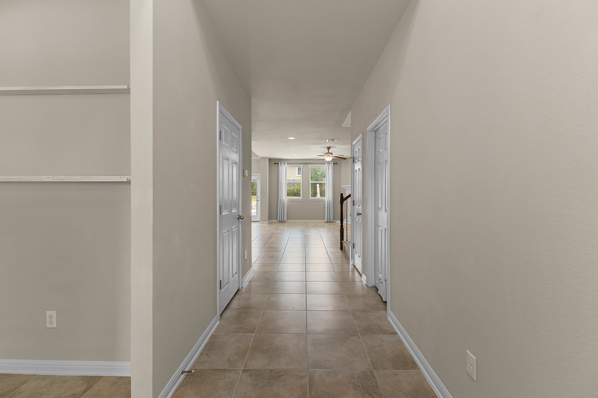2813 Granite Hill Cove Leander, TX 78641 - Photo 33 of 39 Hall featuring baseboards and light tile patterned floors