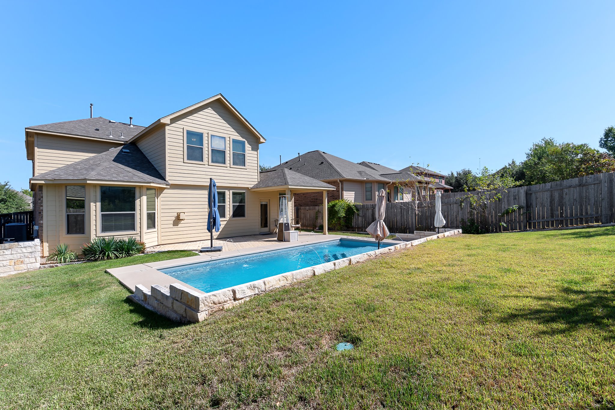 2813 Granite Hill Cove Leander, TX 78641 - Photo 37 of 39 Back of property featuring a patio area and a fenced backyard