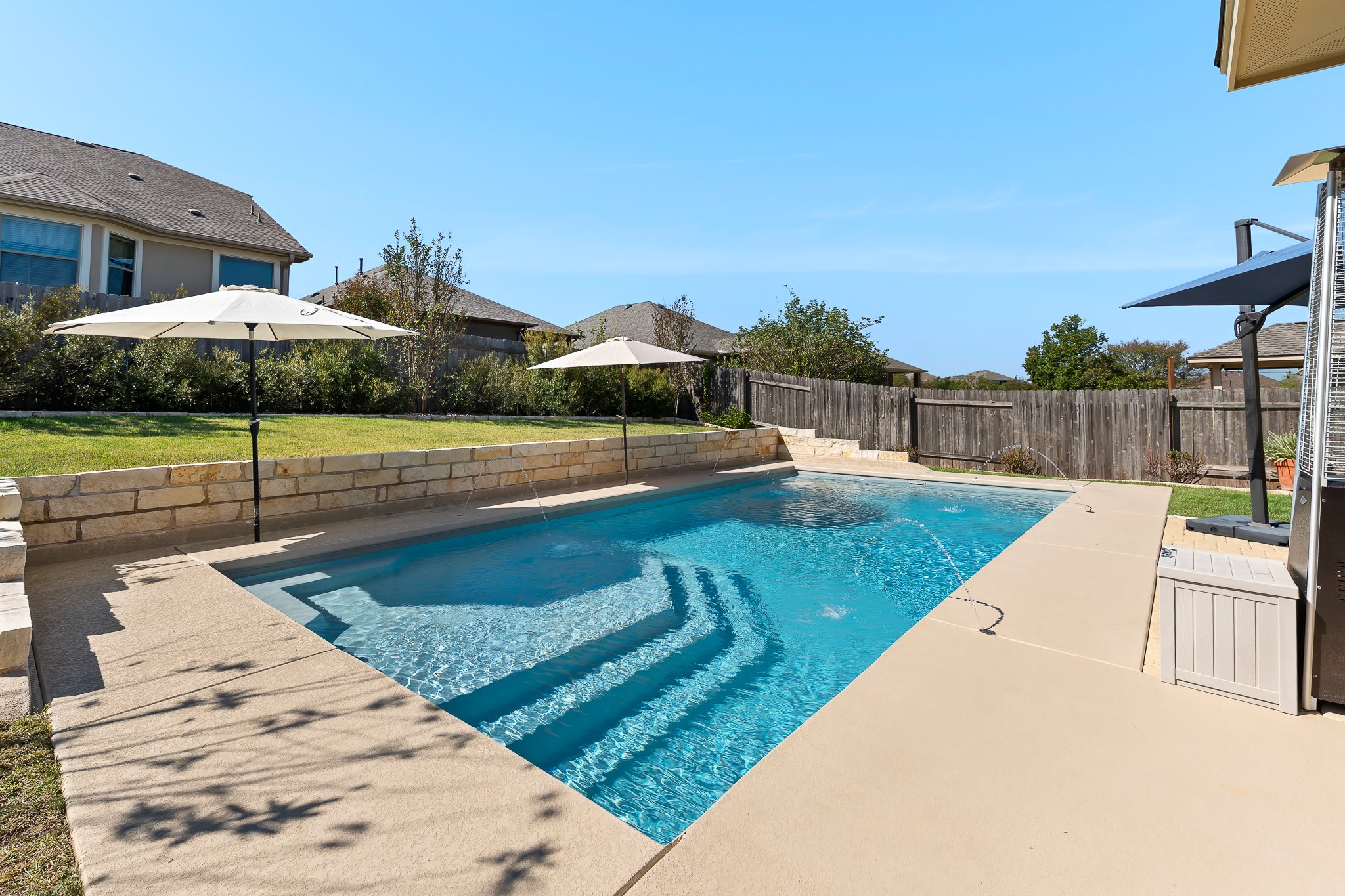 2813 Granite Hill Cove Leander, TX 78641 - Photo 4 of 35 View of swimming pool with a patio and a fenced backyard
