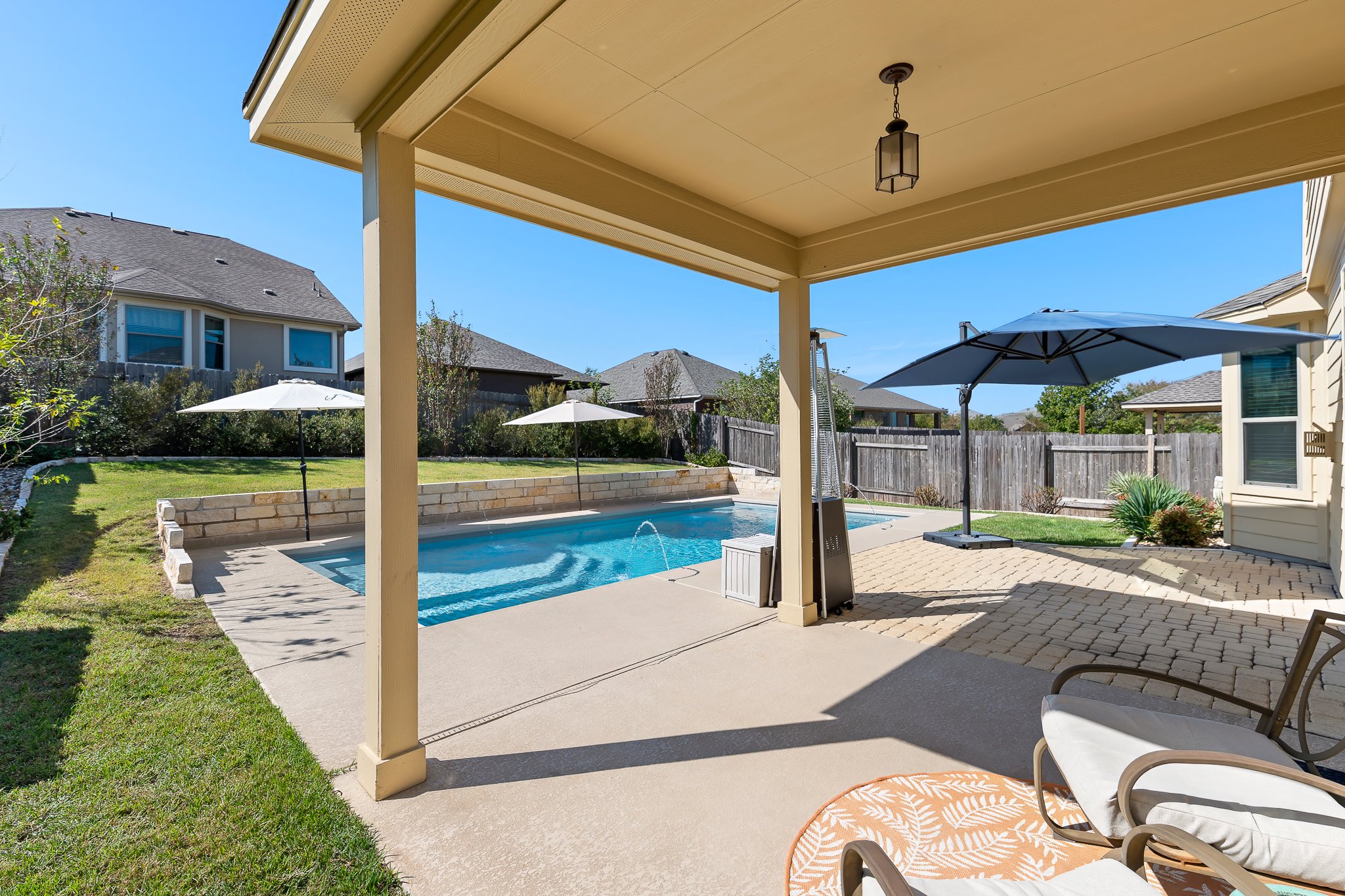 2813 Granite Hill Cove Leander, TX 78641 - Photo 5 of 39 View of swimming pool with covered patio and a fenced backyard
