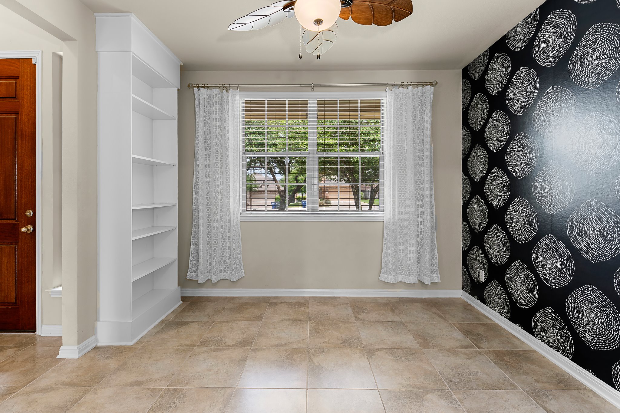 2813 Granite Hill Cove Leander, TX 78641 - Photo 7 of 39 Home office featuring wallpapered walls, an accent wall and a ceiling fan