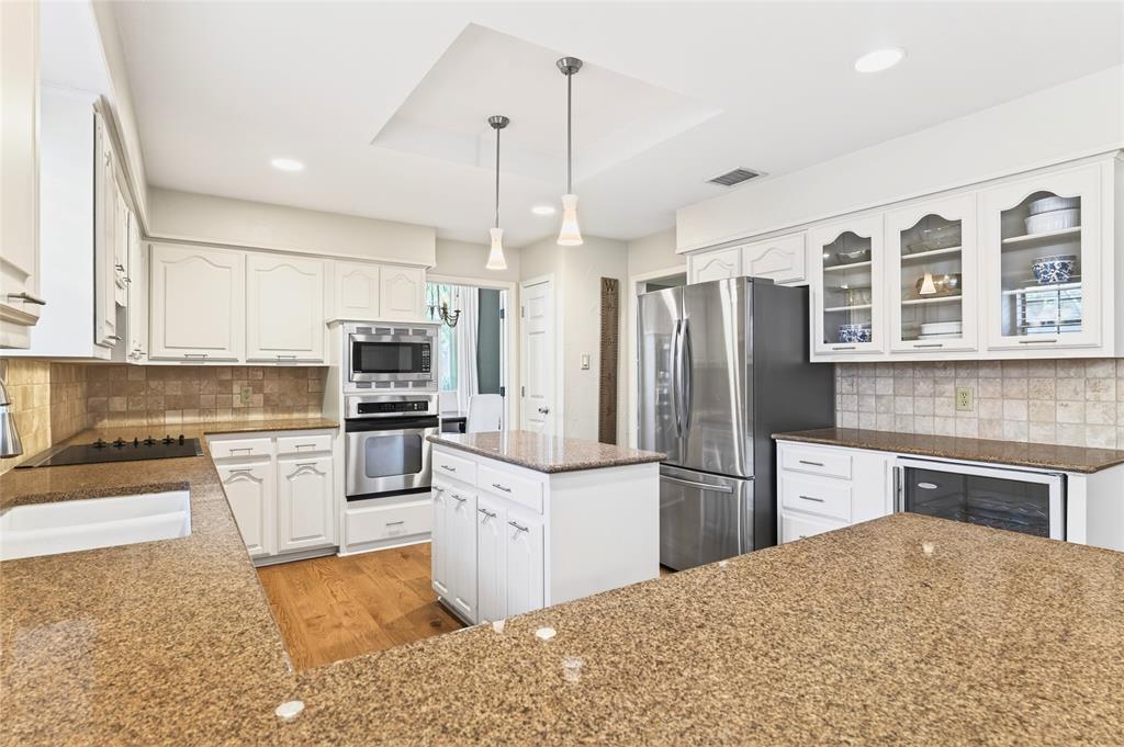 819 Lockhaven Lane Coppell, TX 75019 - Photo 15 of 33 A built-in beverage fridge adds a practical touch right where you’ll actually use it.
