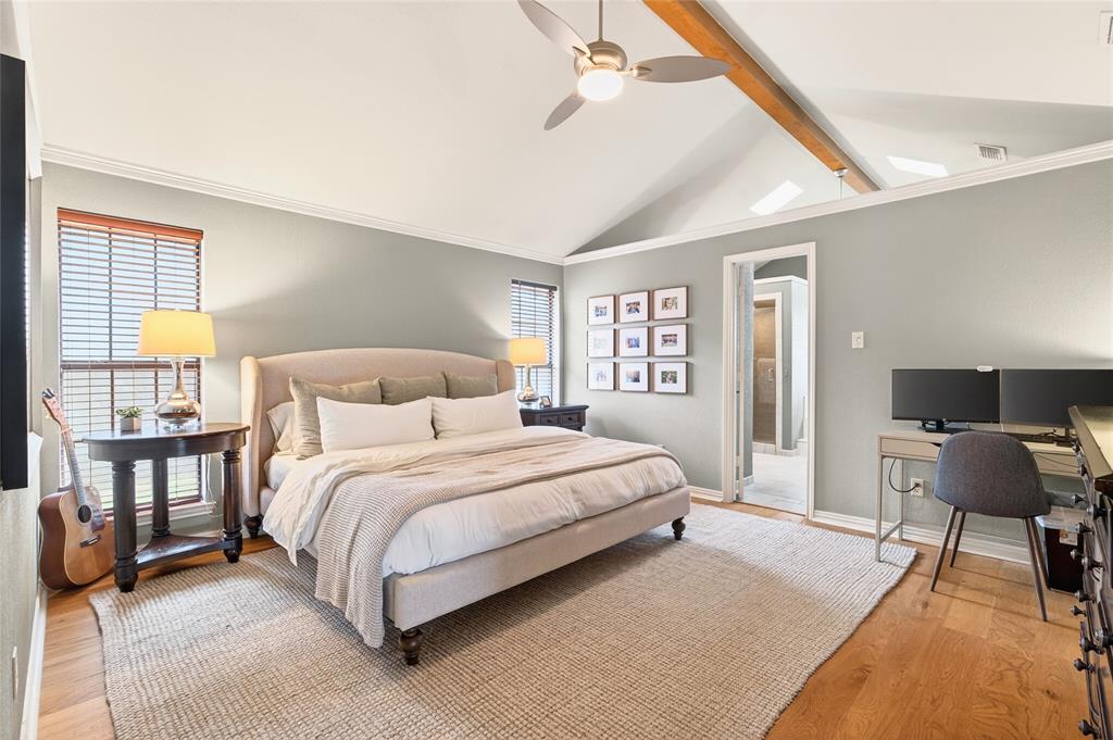 819 Lockhaven Lane Coppell, TX 75019 - Photo 19 of 33 A primary bedroom with a direct connection to the ensuite, keeping everything easy and functional.