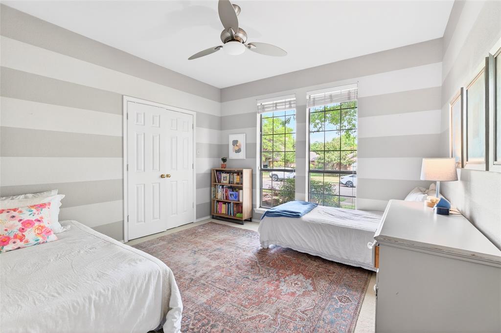 819 Lockhaven Lane Coppell, TX 75019 - Photo 24 of 33 A flexible secondary bedroom that works just as easily for guests, a home office, or both.