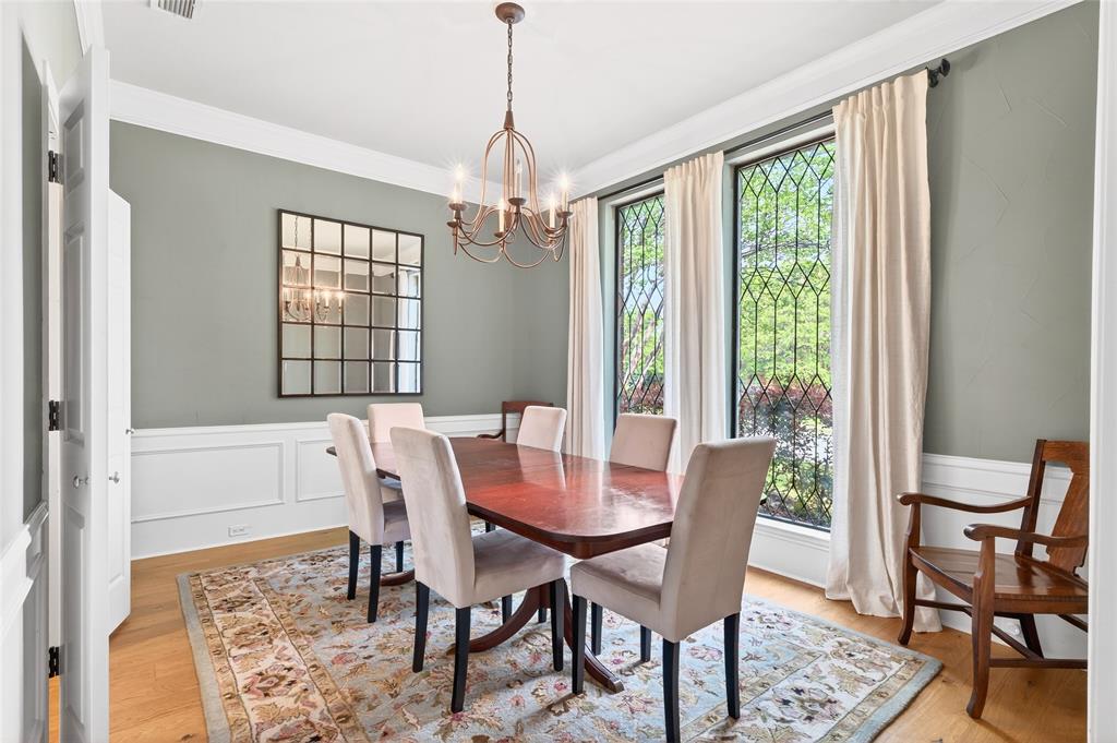 819 Lockhaven Lane Coppell, TX 75019 - Photo 3 of 33 Diamond-pane leaded glass windows and raised panel wainscoting give the dining room a sense of character that’s hard to recreate.