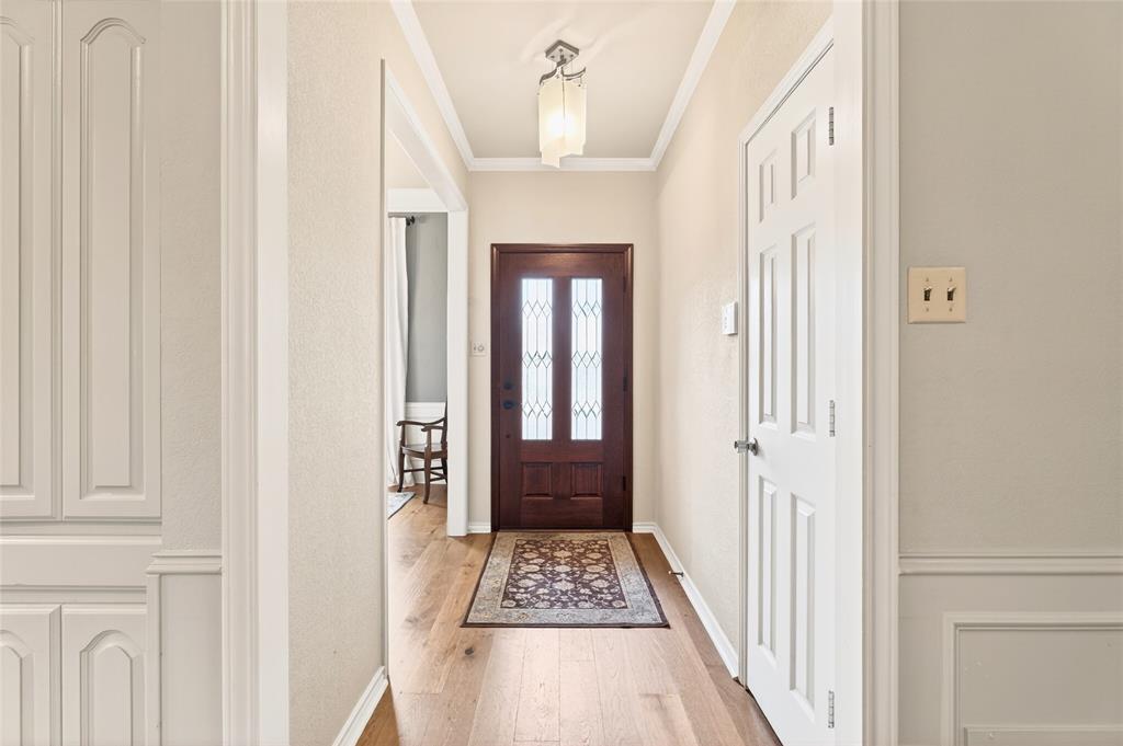 819 Lockhaven Lane Coppell, TX 75019 - Photo 4 of 33 A welcoming entry that quietly introduces the craftsmanship you’ll see throughout the home.