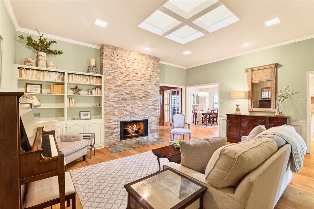819 Lockhaven Lane Coppell, TX 75019 - Photo 6 of 33 A skylight overhead brings in natural light that plays across the hardwood floors and built-ins throughout the day.