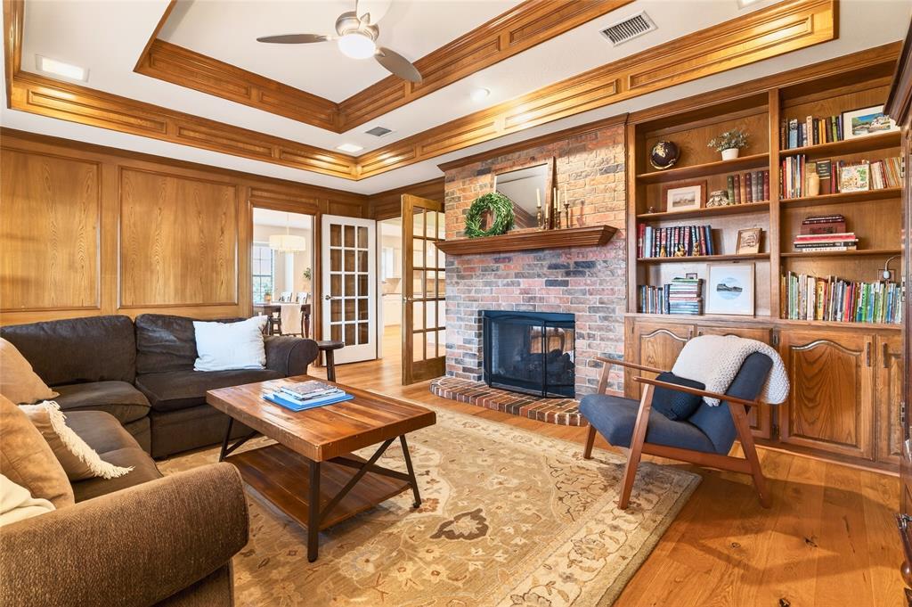 819 Lockhaven Lane Coppell, TX 75019 - Photo 9 of 33 The other side of the double-sided fireplace—keeping both living areas connected while letting each have its own feel.
