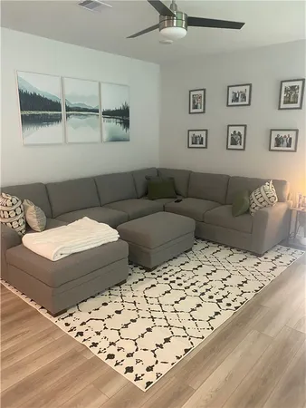a living room with a bed and a couch