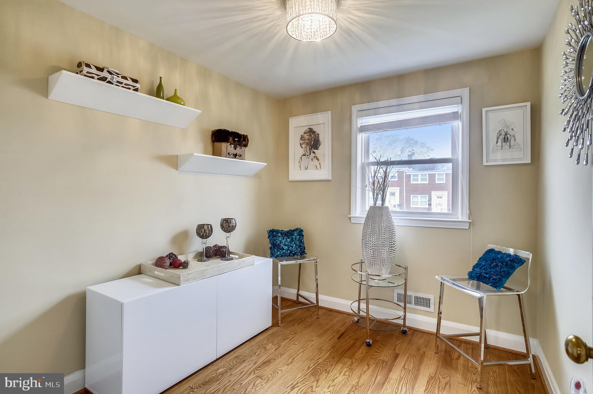 1409 Langford Road Baltimore, MD 21207 - Photo 22 of 39 a living room with furniture and a wooden floor