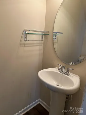 a bathroom with a sink and mirror