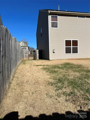 a view of a backyard of the house
