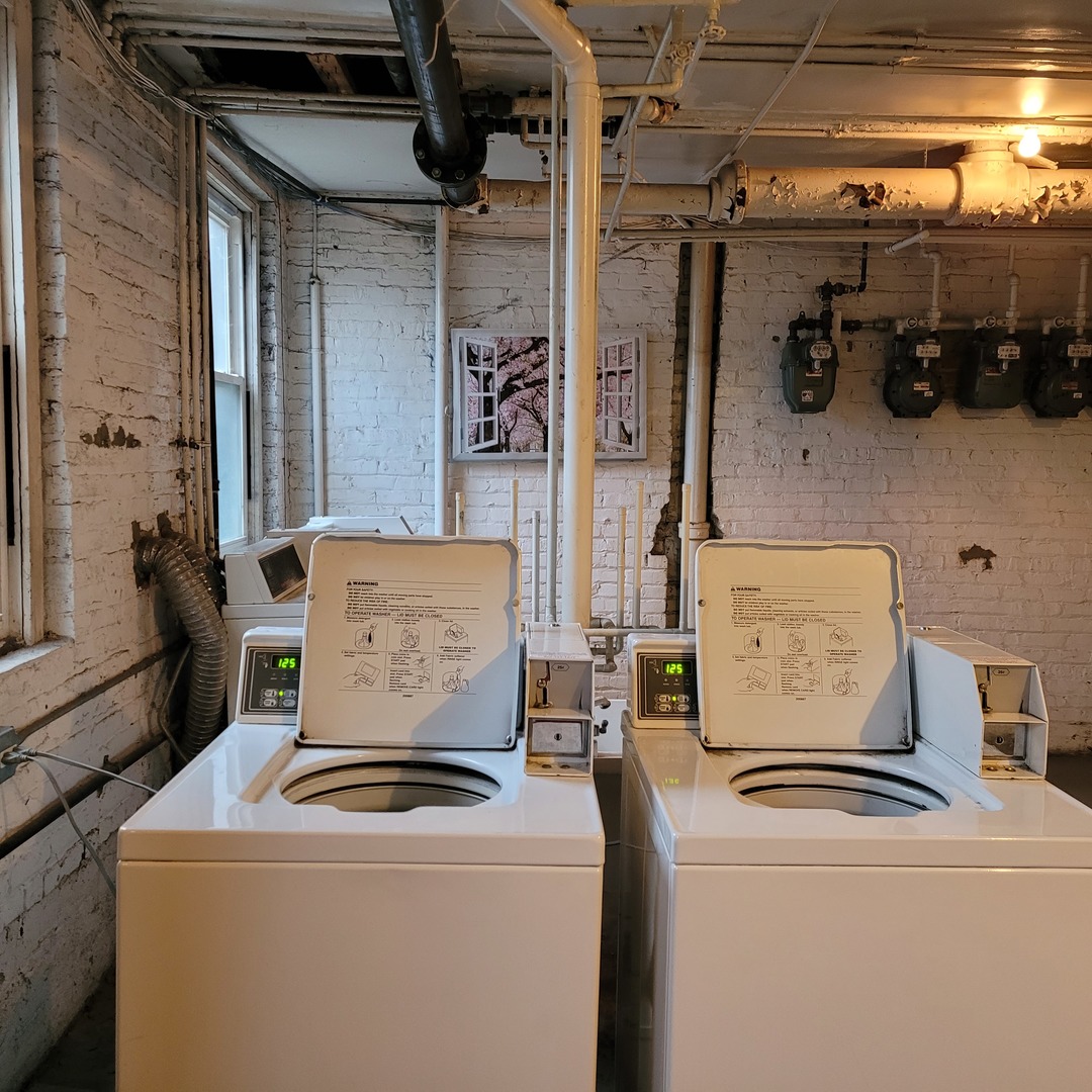 56 Forest Avenue, Unit 1N Riverside, IL 60546 - Photo 19 of 21 a utility room with dryer and washer