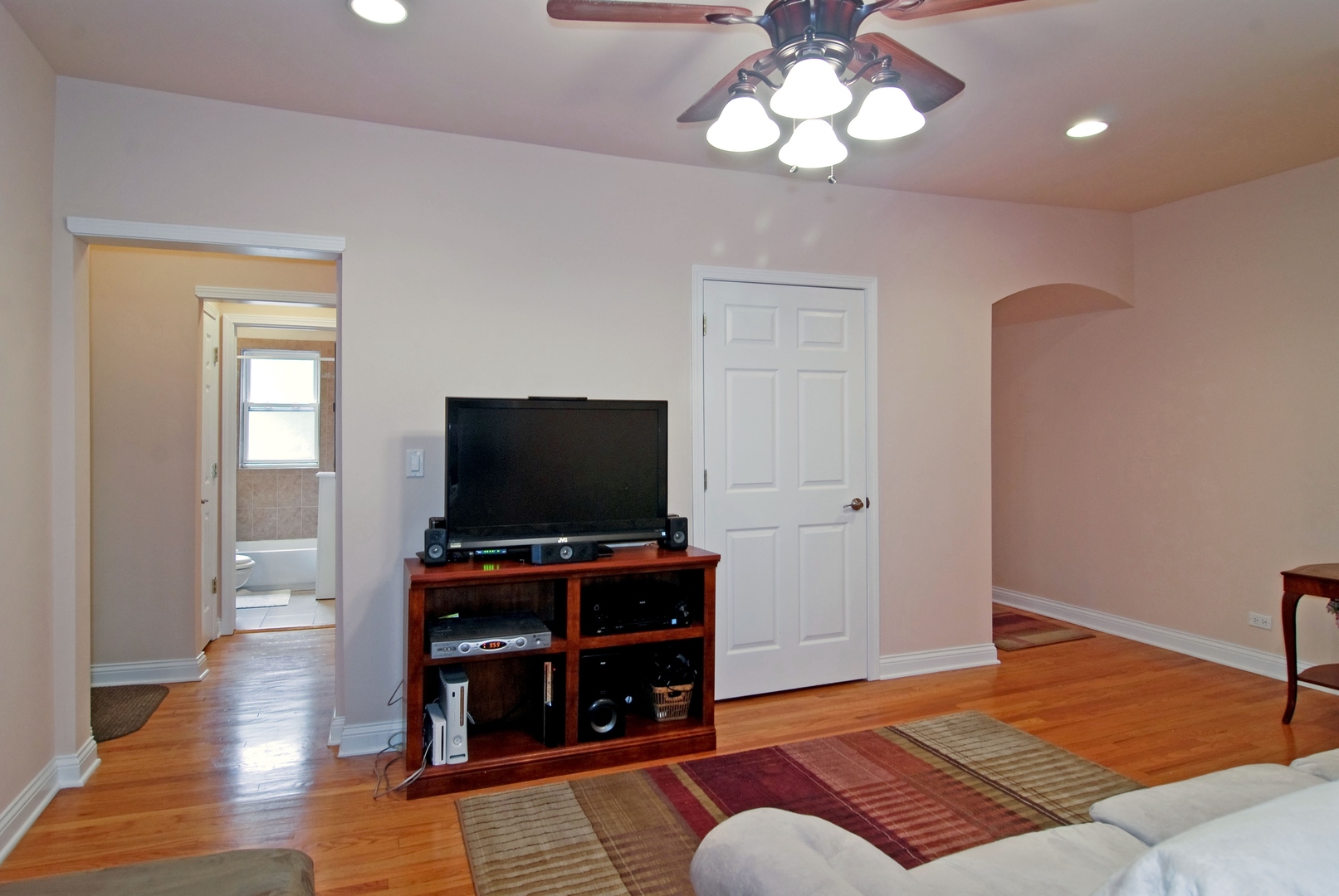 56 Forest Avenue, Unit 1N Riverside, IL 60546 - Photo 6 of 21 a living room with furniture and a flat screen tv