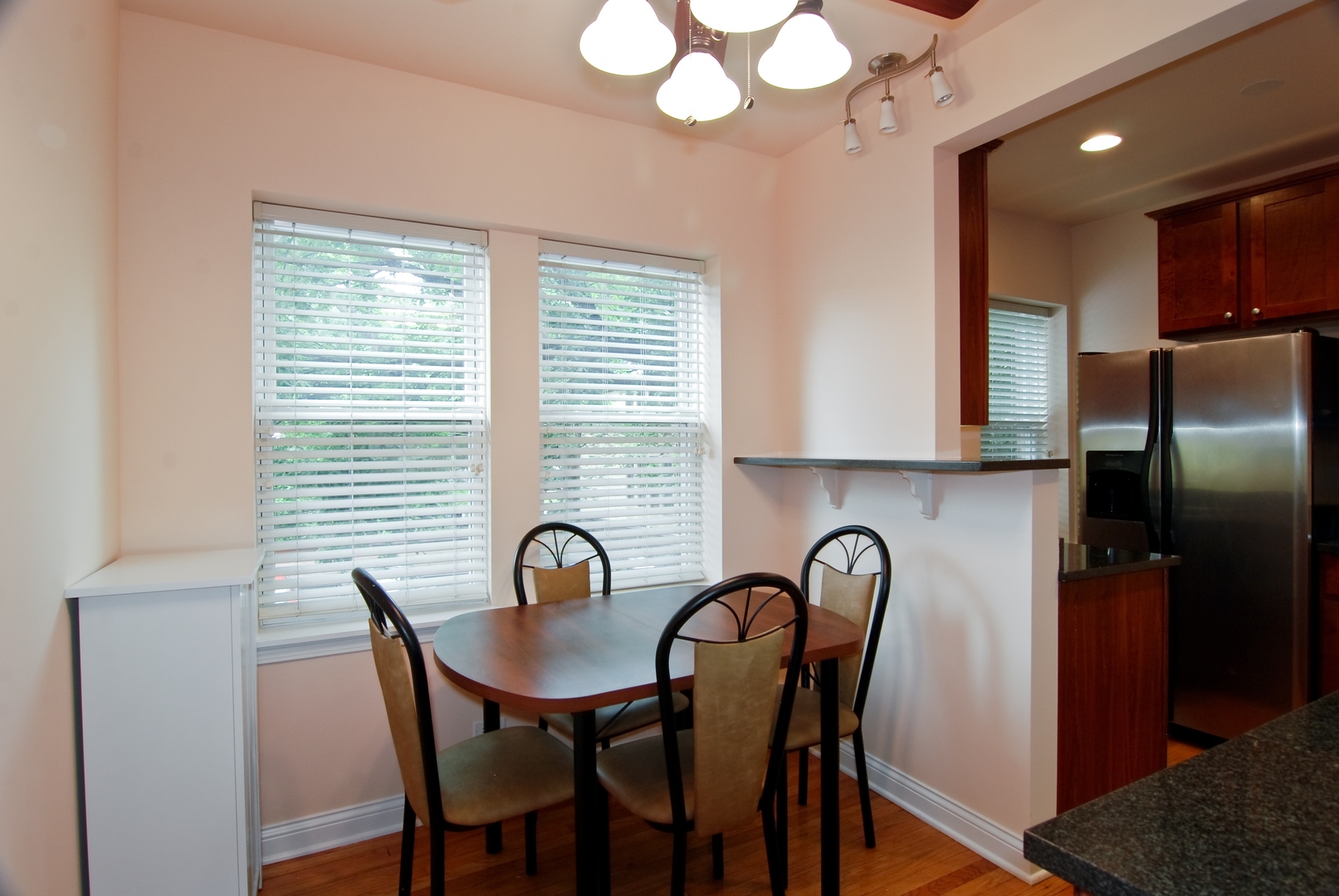 56 Forest Avenue, Unit 1N Riverside, IL 60546 - Photo 10 of 21 a view of a dining room with furniture and window