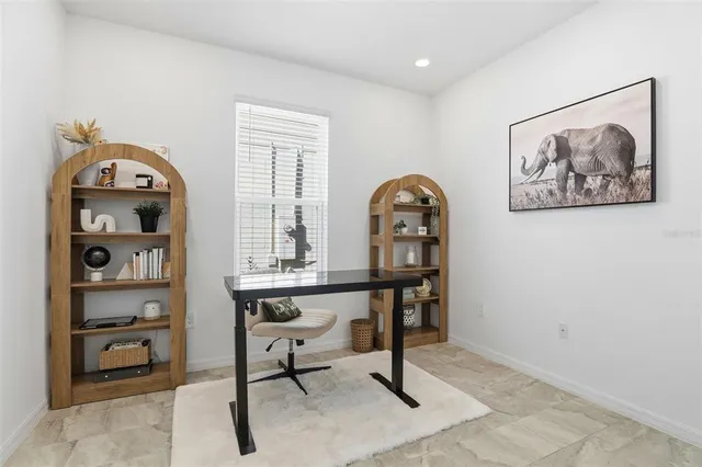 a view of a workspace with furniture