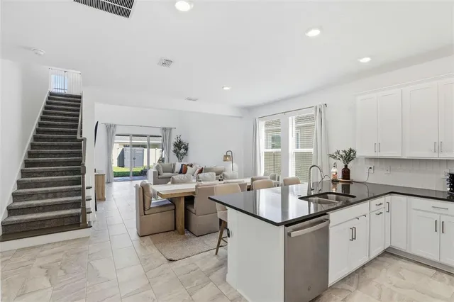 a kitchen with a sink and cabinets