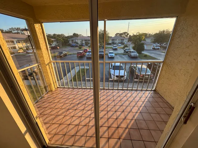 a view of a balcony with furniture