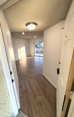 wooden floor in an empty room with a fireplace