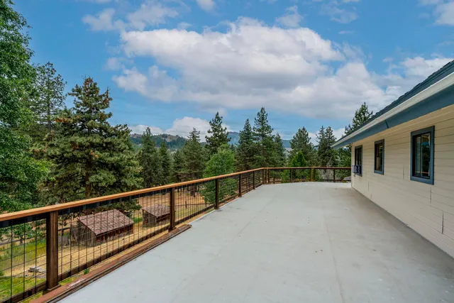 a view of balcony with two and trees